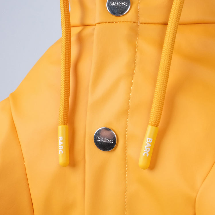 orange dog raincoat with branded poppers, from barc london