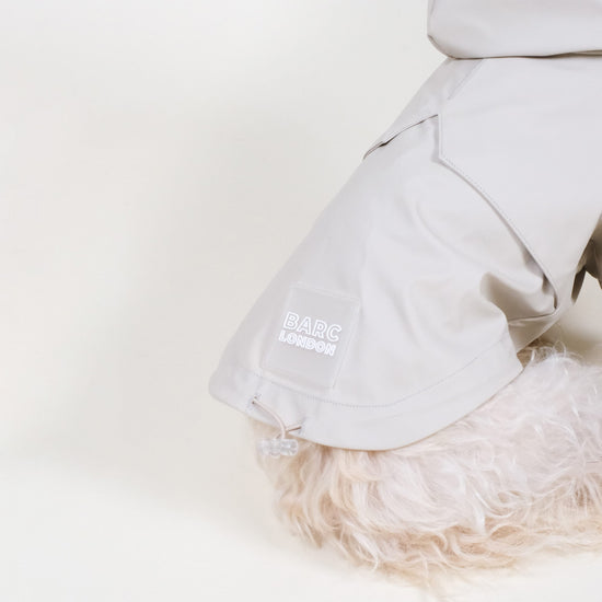 barc london dog raincoat, worn by a small terrier in the colour stone