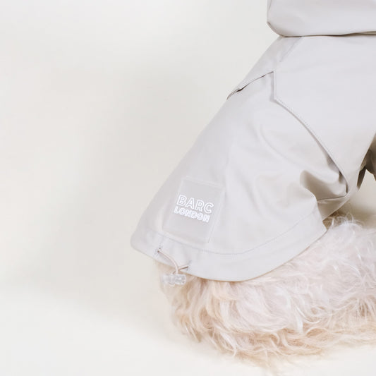 barc london dog raincoat, worn by a small terrier in the colour stone