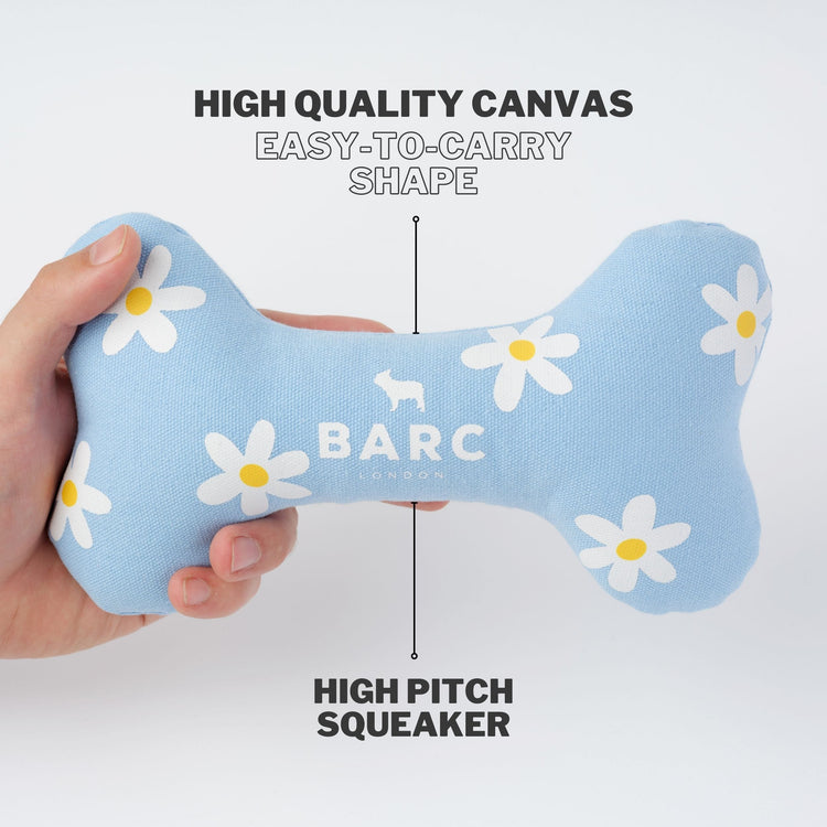 Blue Dog Bone Toy With Daisy Print Design. Made From High Quality Canvas With High Pitched Squeaker 