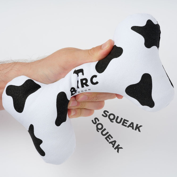 Fabric Dog Bone Toy in Black and White Cow Print Design With ‘Squeak’ Feature