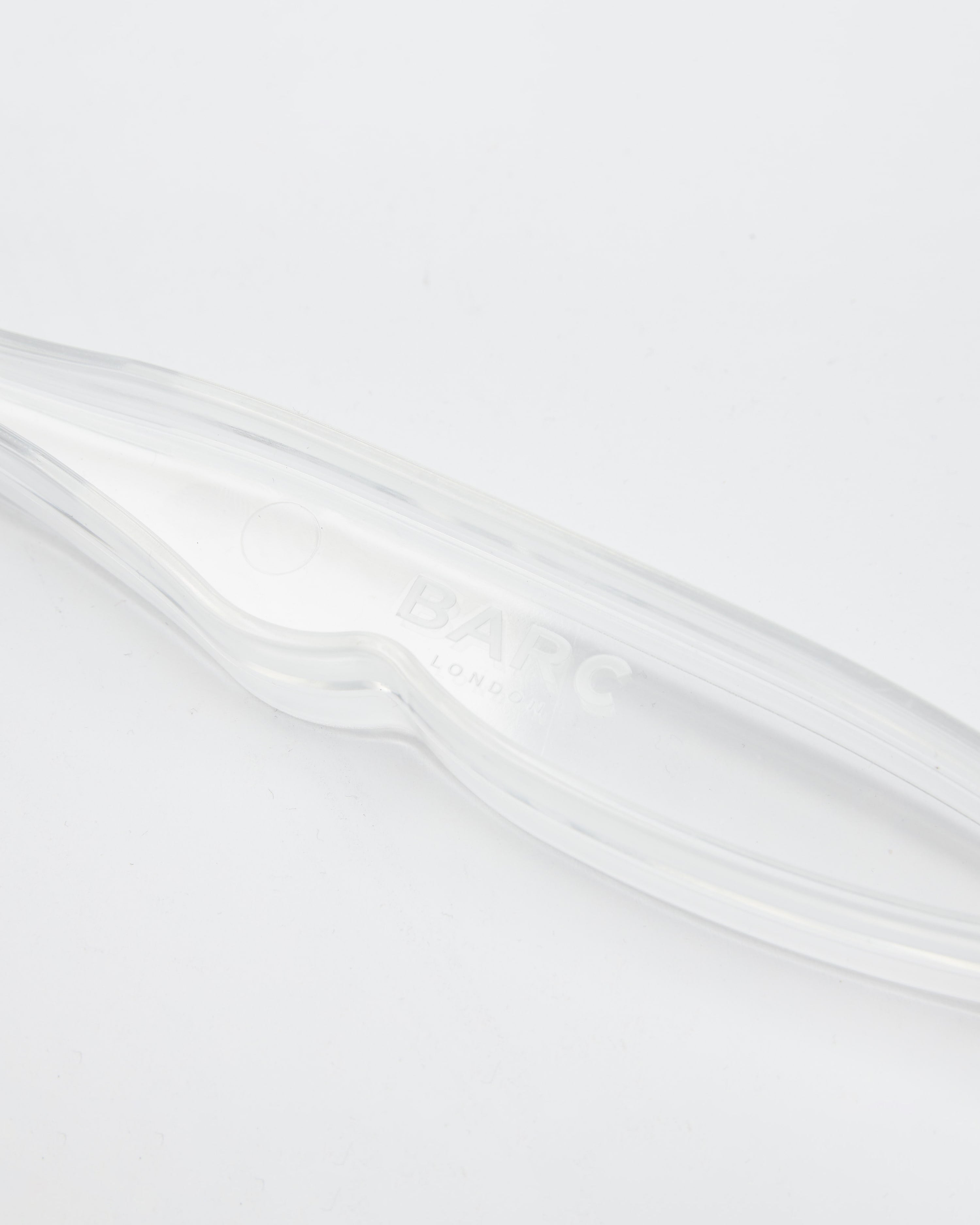 Arm of Tennis Ball Thrower with Barc London Branding Detail